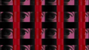 Video still from the video Eye Sees Time, showing four horizontal rows of eyes in a purple shade of color, with four columns of red color.